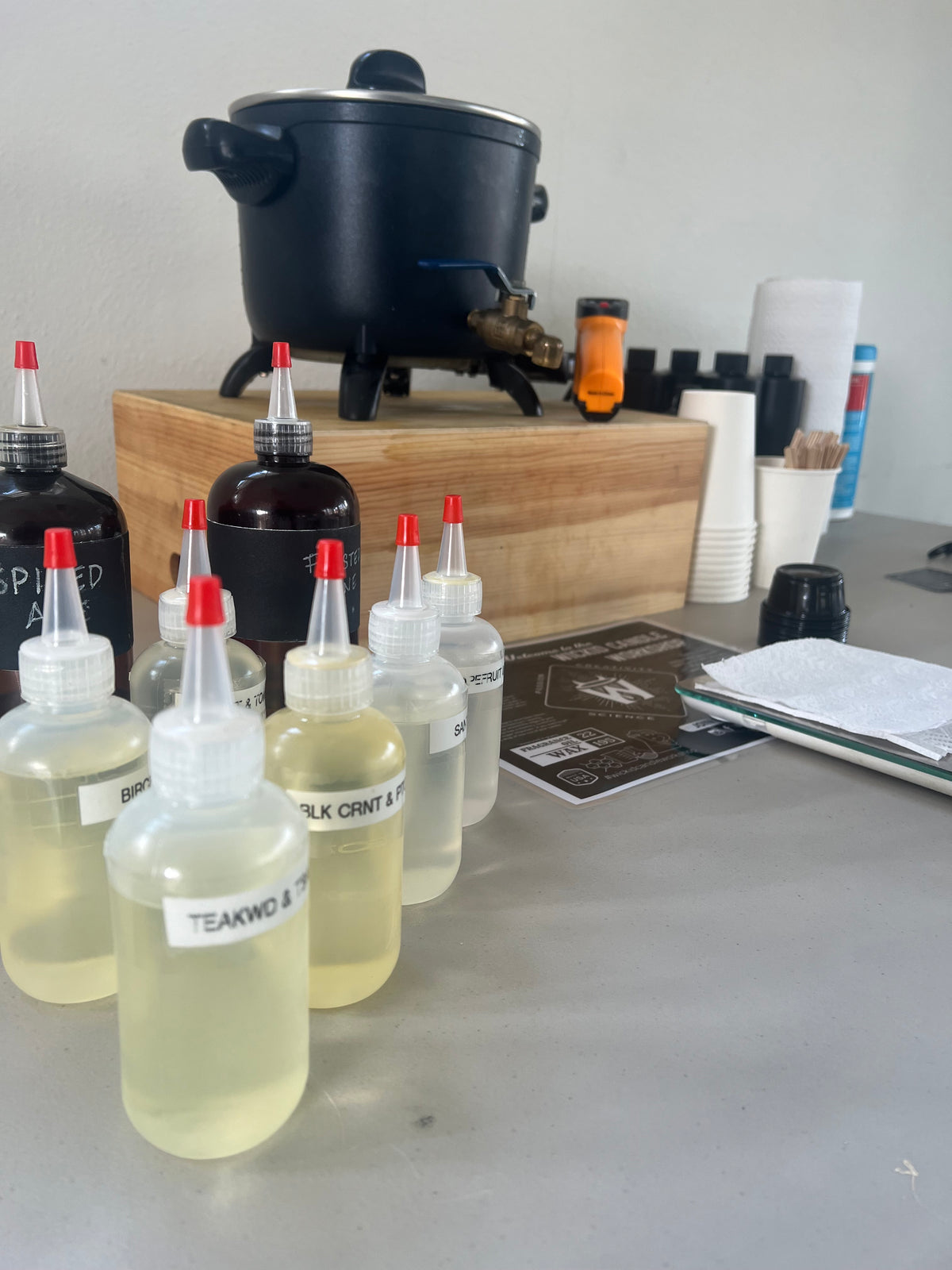 Wickid fragrance bottles and candle-making equipment